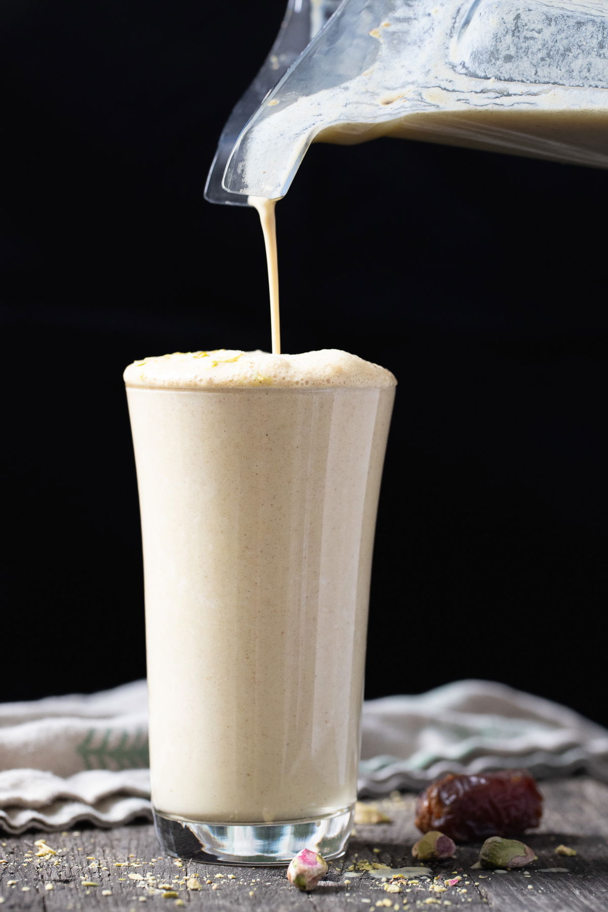 Pouring the date milk from the blender