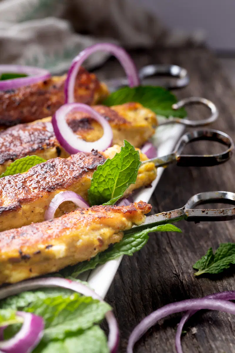 Close of of reshmi kabab with skewers