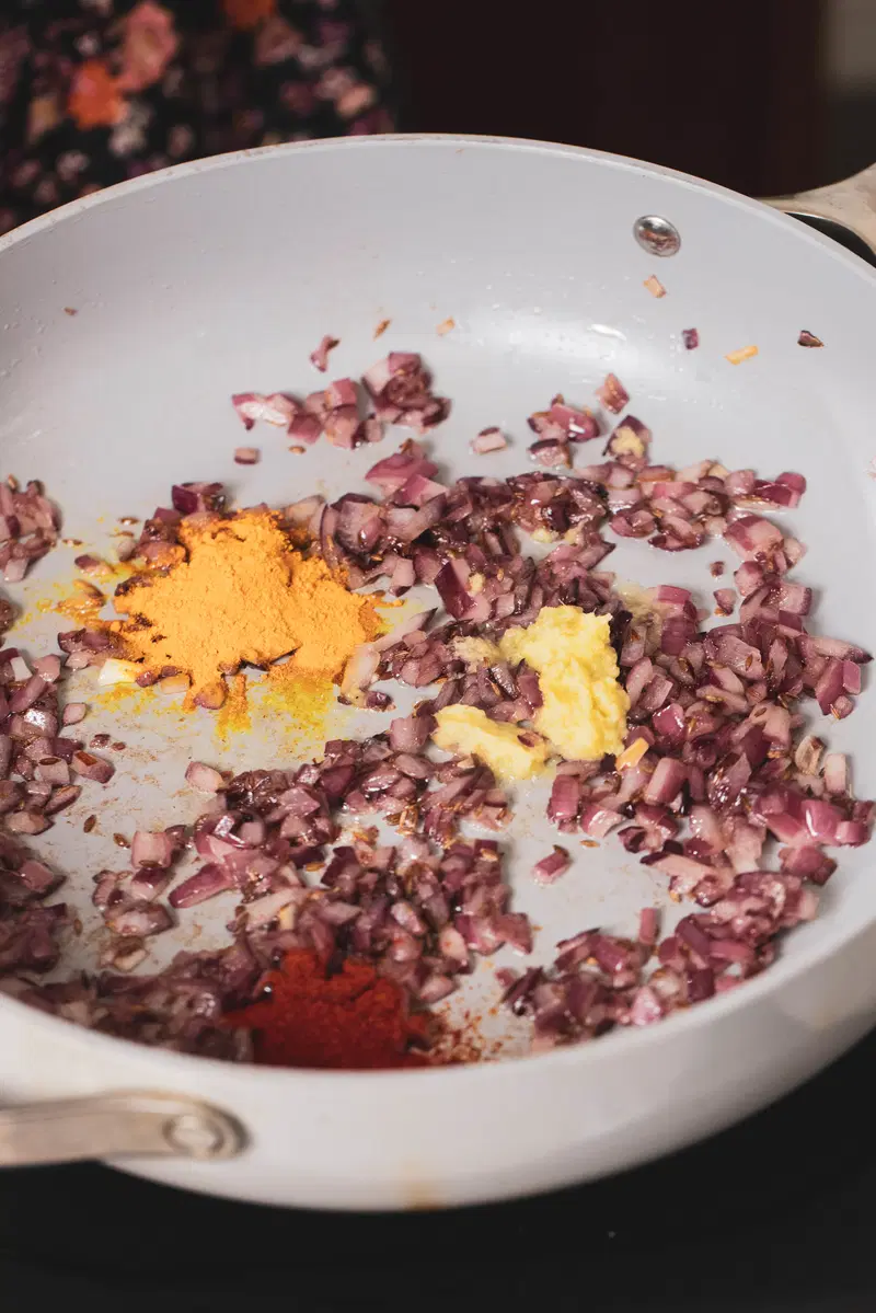 Add turmeric, ginger, and chili powder.