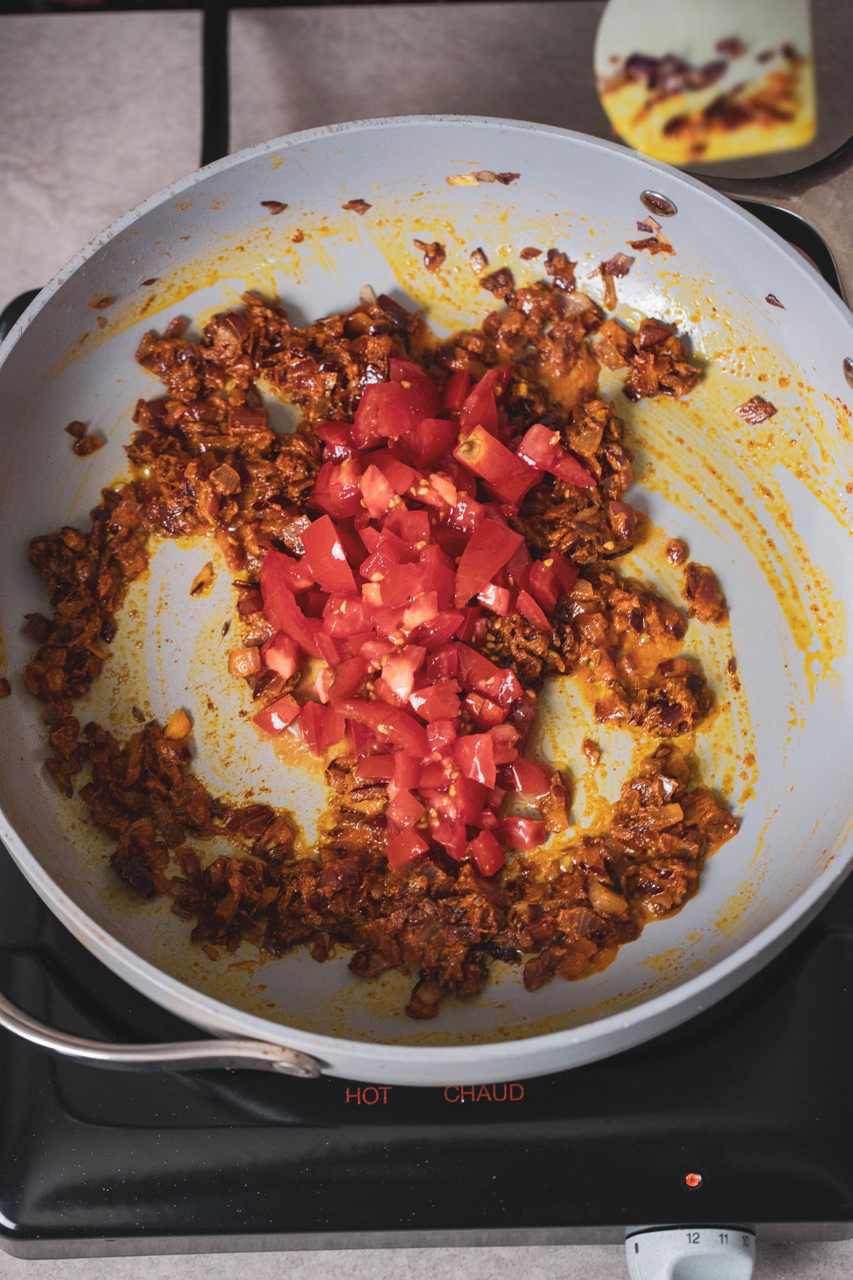 Cook the tomatoes.