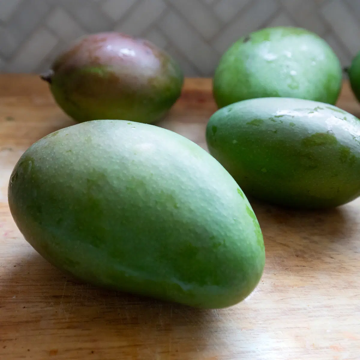Mangoes on a cutting board