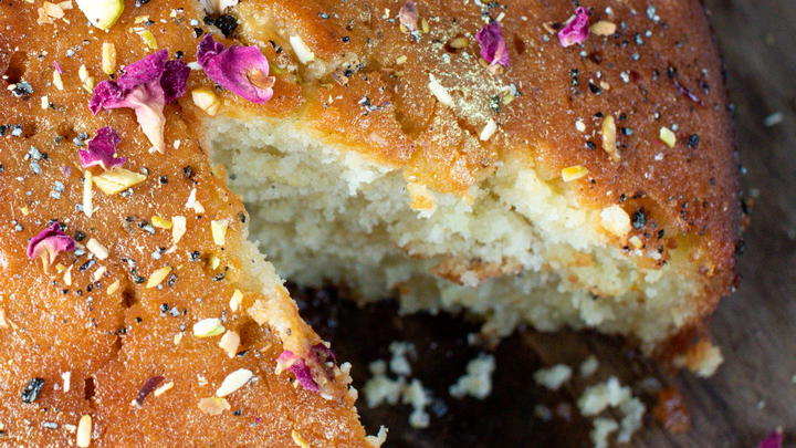 Gulab jamun cake with a slice removed