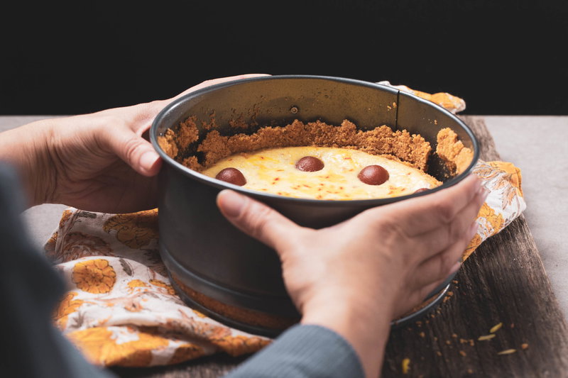 Removing the cheesecake from the pan.