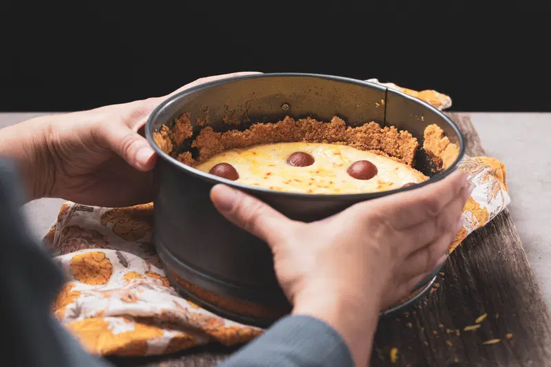 Removing the cheesecake from the pan.