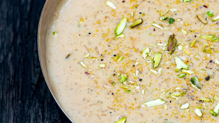 Bowl of kheer garnished with pistachios
