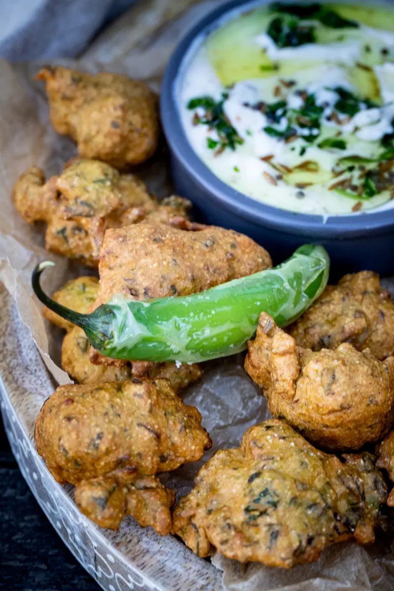Methi na gota with spiced yogurt dip