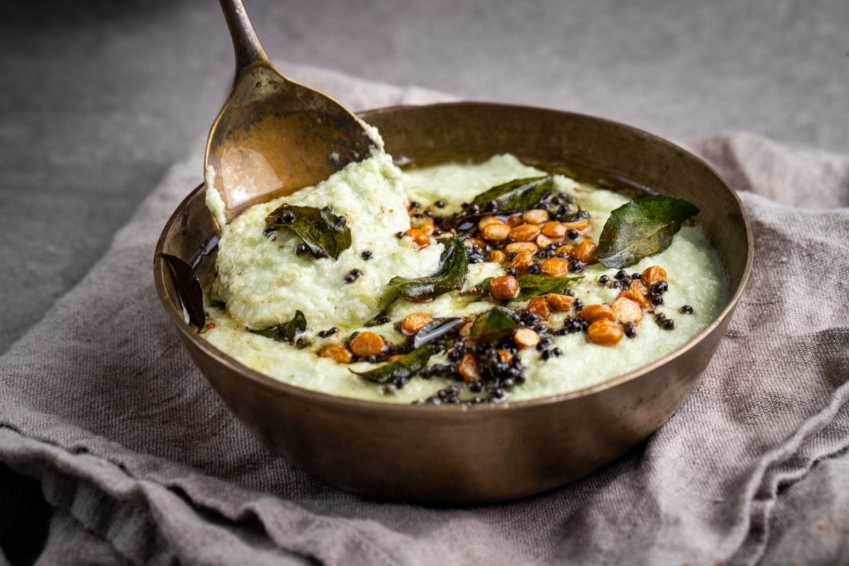 Bowl of coconut chutney with a spoon