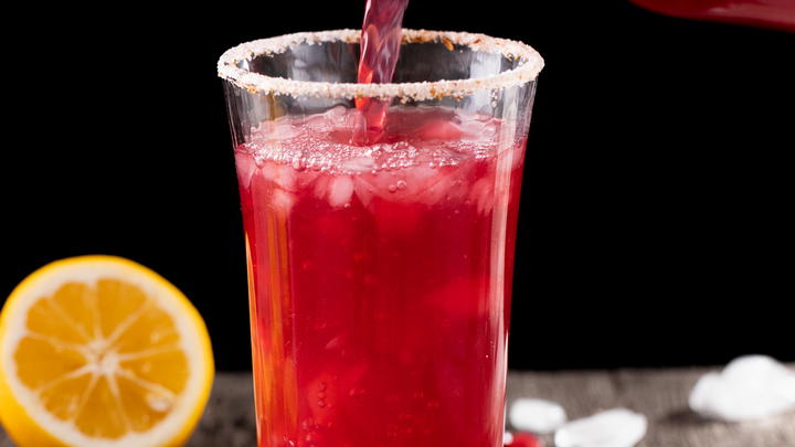 Pouring pomegranate lemonade