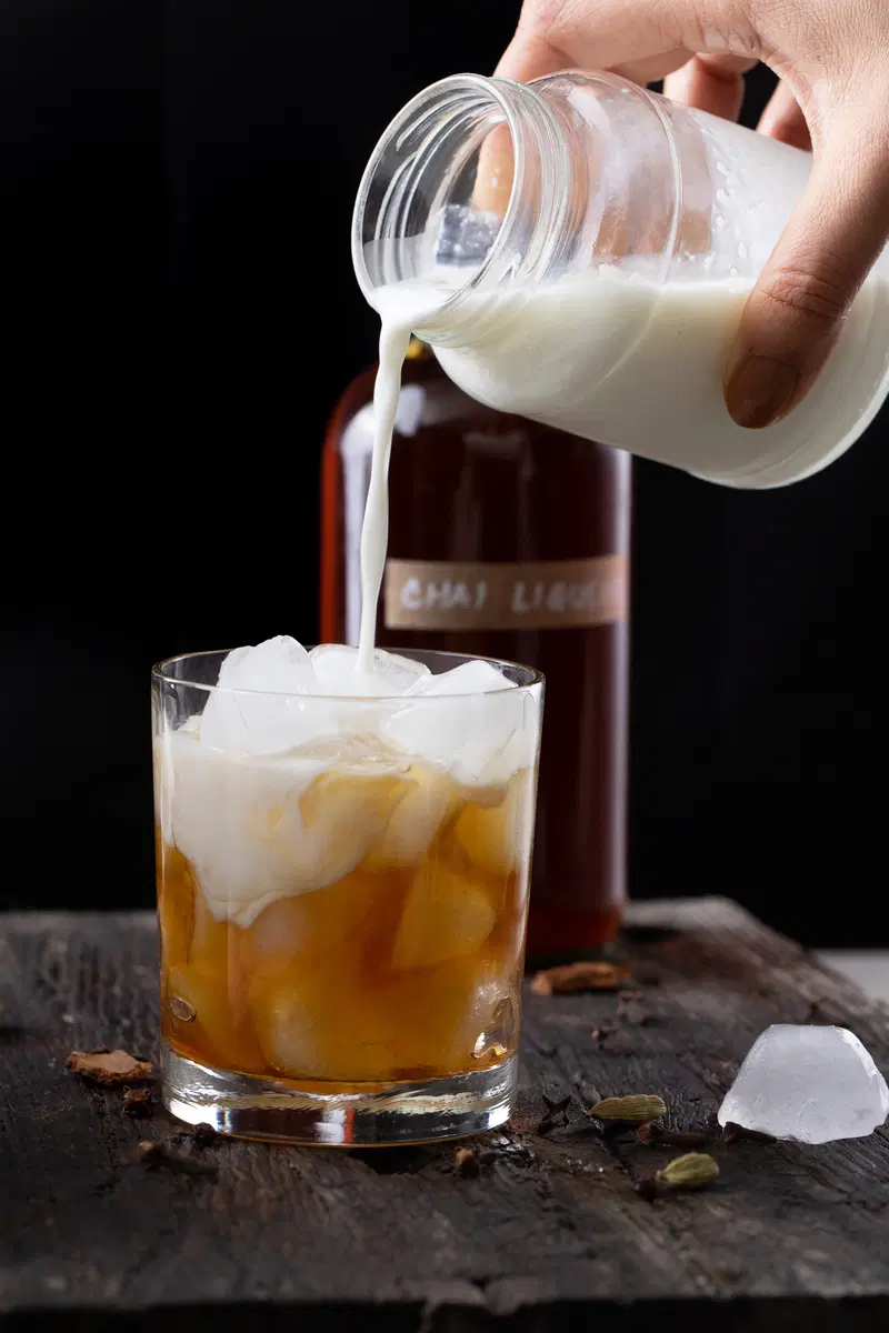 Pouring the milk into the chai white russian