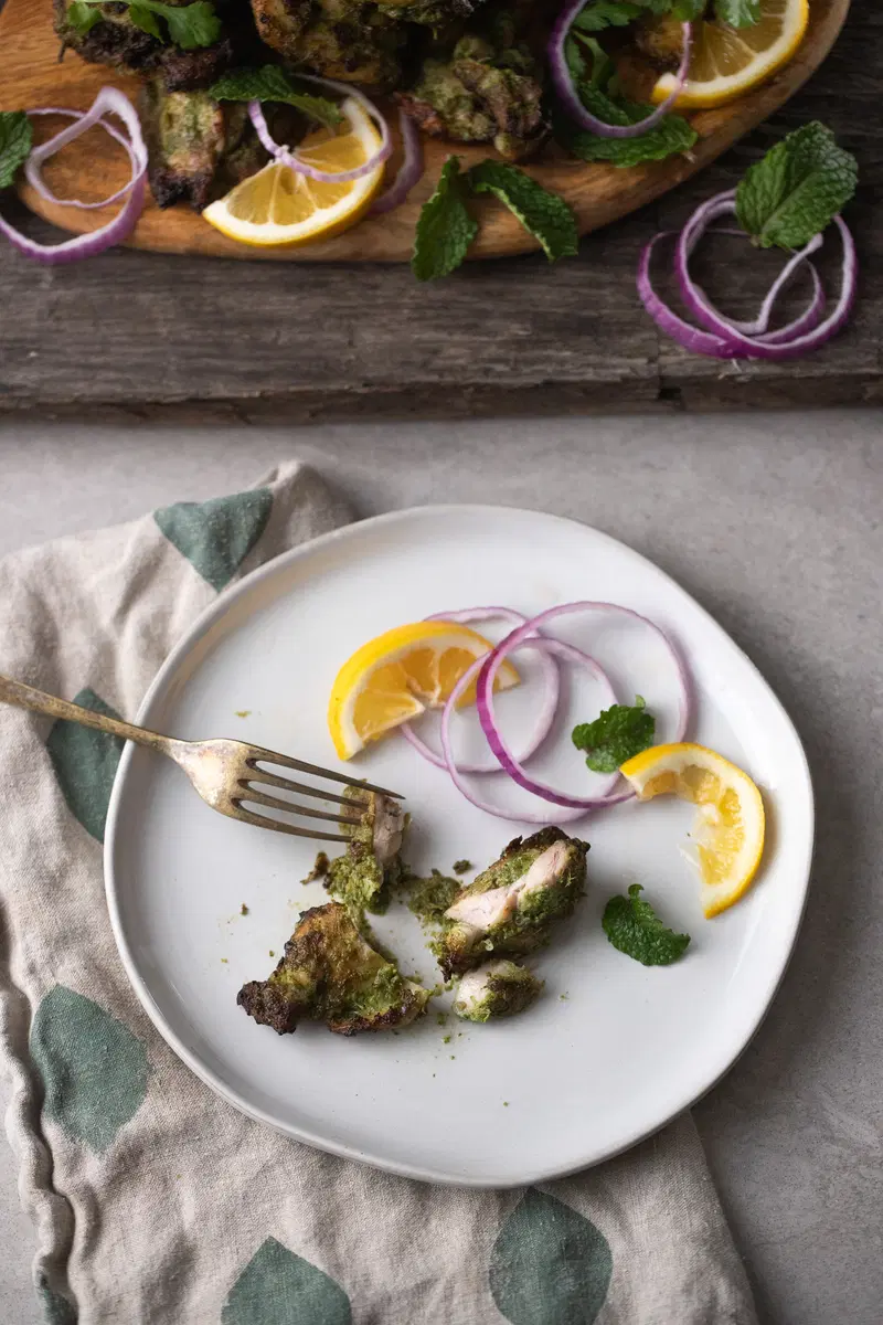 A plate in front of the hariyali chicken platter