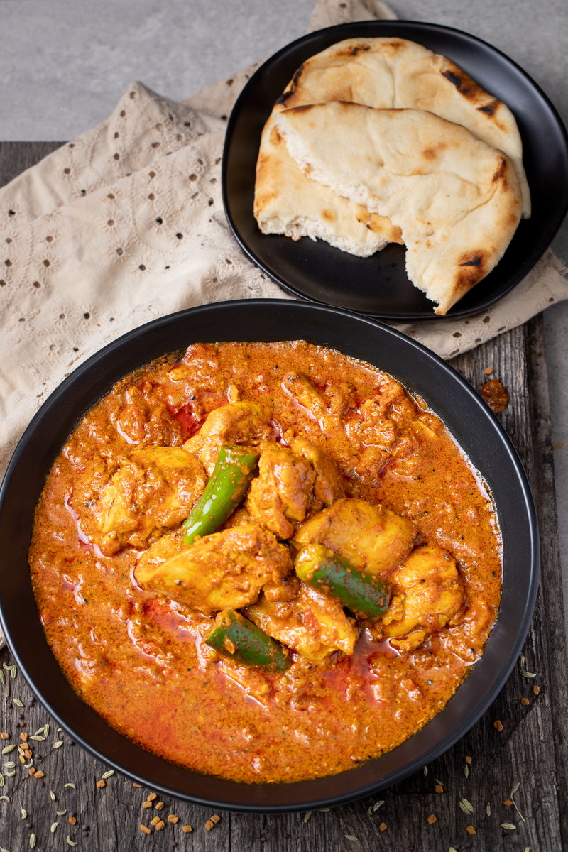 Achari chicken served with roti