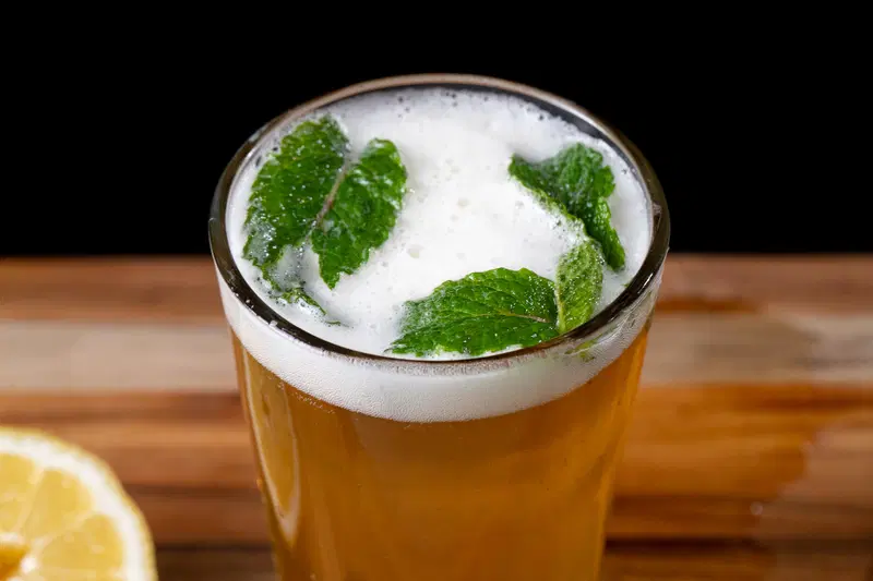 Mint leaves garnishing a mint shandy