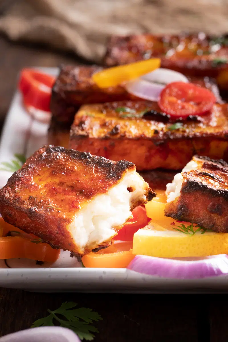 Dahi is used as the base of the marinade for paneer tikka.