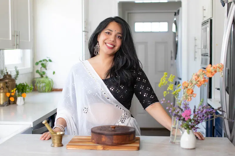 Portrait of Puja in the kitchen.