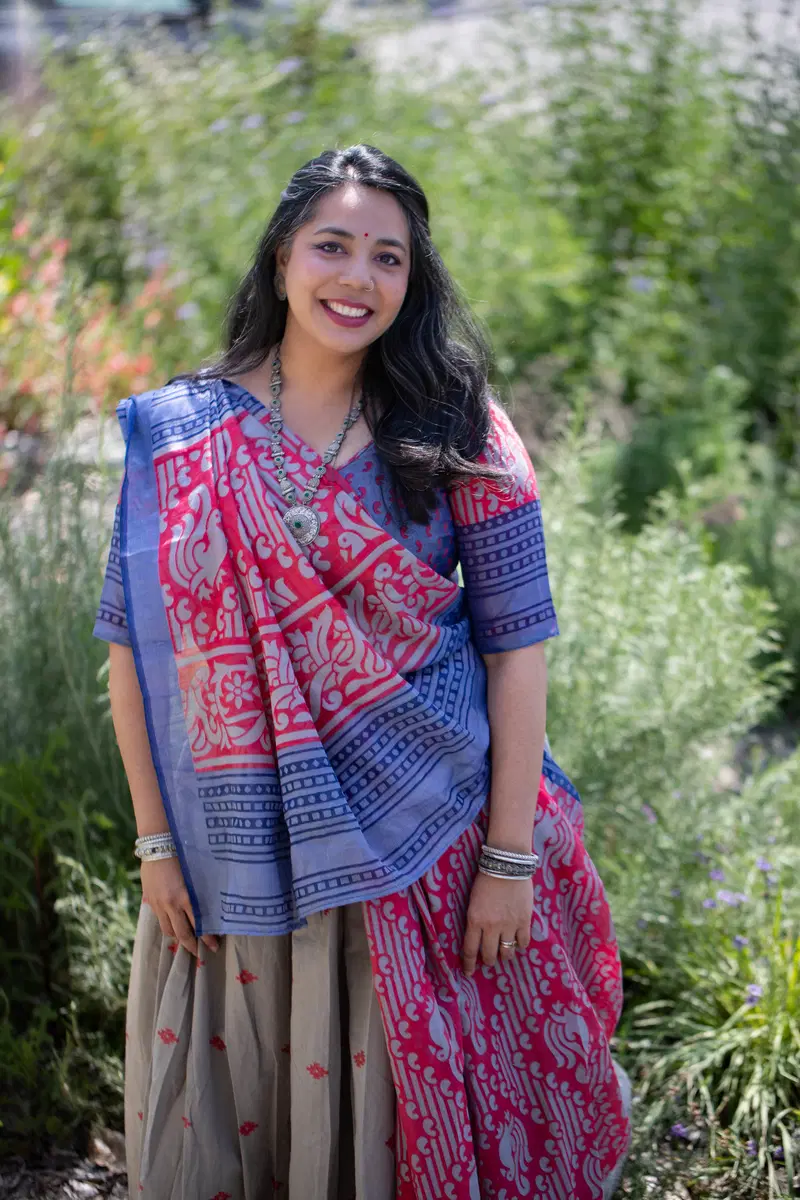 Puja surrounded by flowering plants.