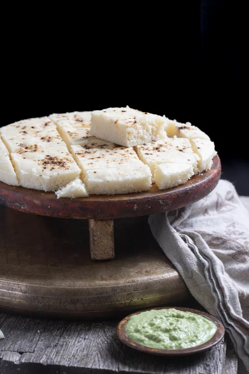 Dhokla on a stand with chutney