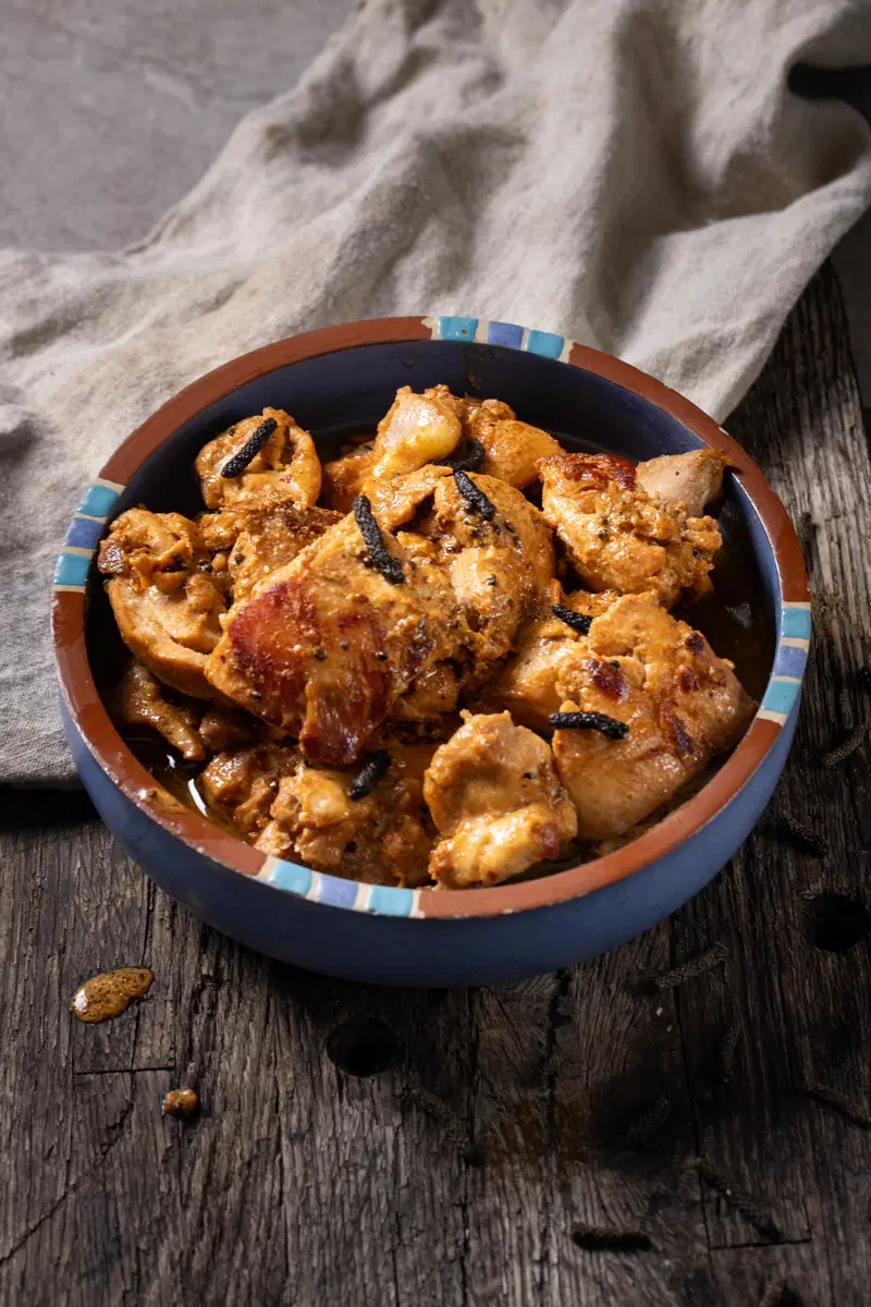 A bowl of long pepper chicken.