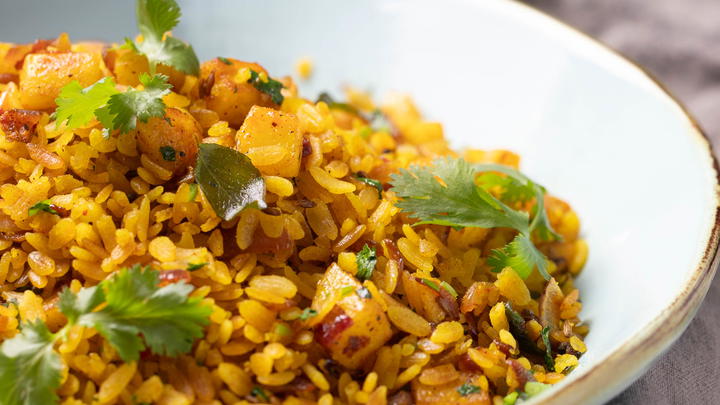 Bowl of red rice poha
