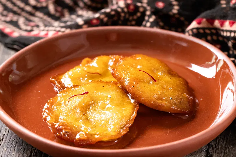 Malpua served on a plate.