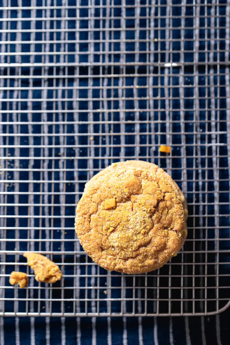 A mango cookie on a cooling rack