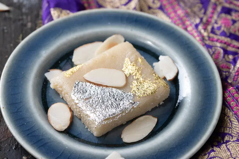 Almond katli on a plate.