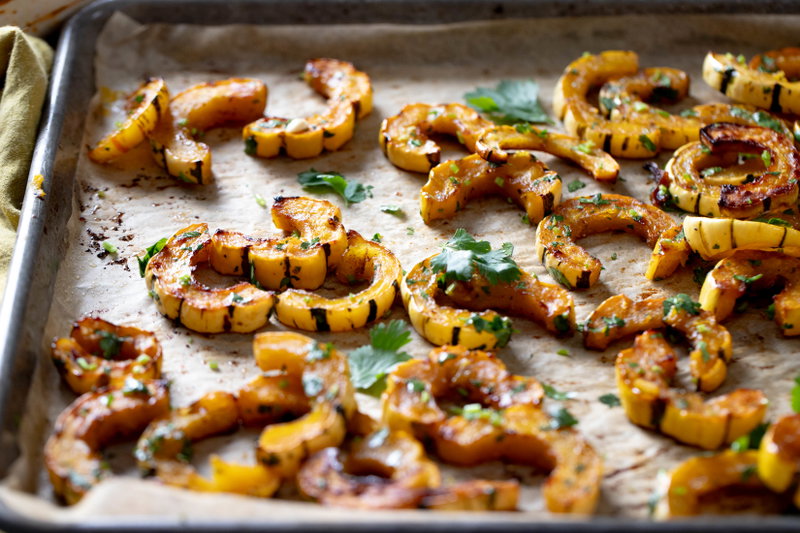 Masala delicata squash on a sheet pan