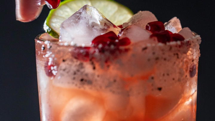 Dropping an aril on a pomegranate margarita