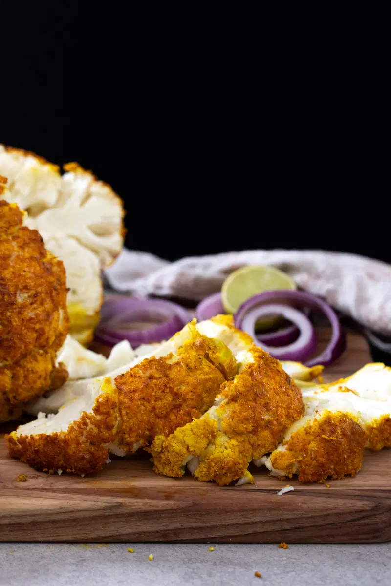 Sliced whole roasted tandoori cauliflower