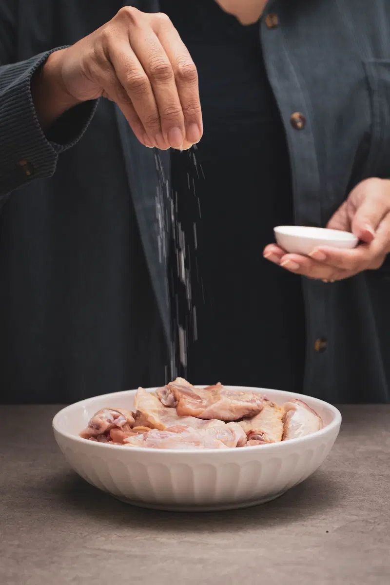 Salt the chicken.