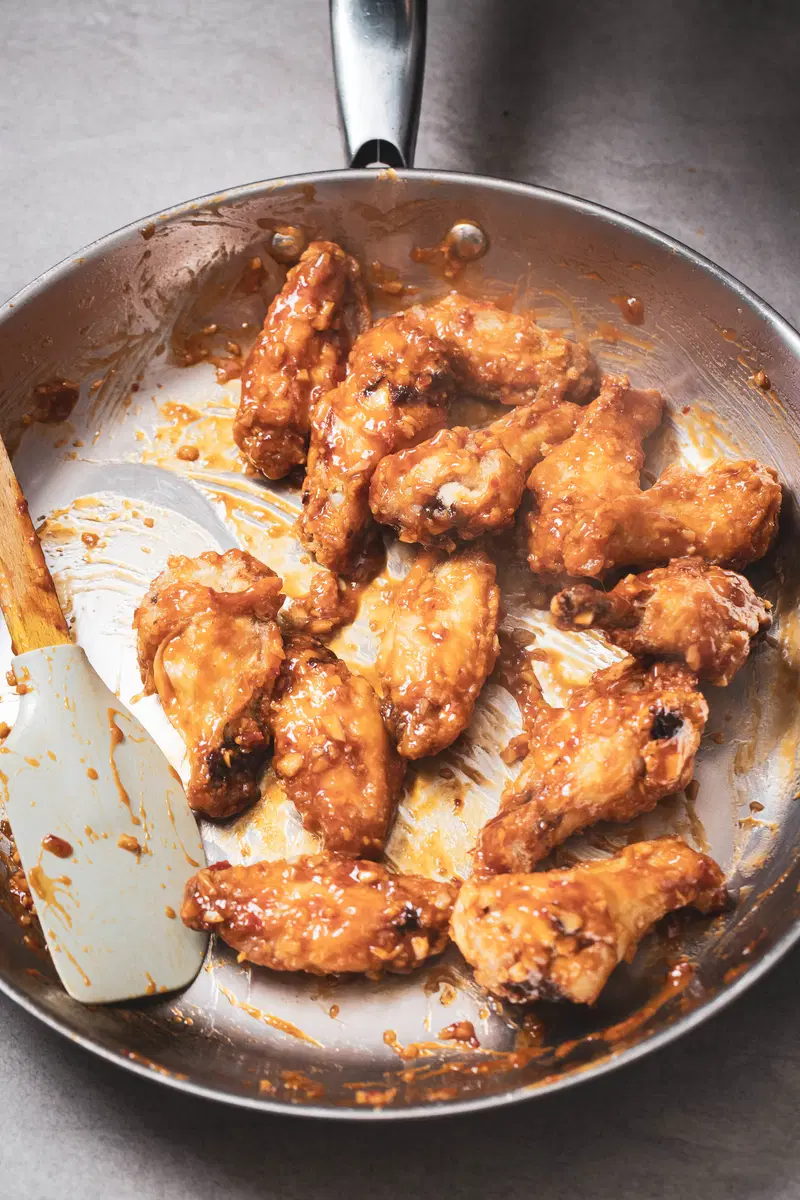 Toss the wings to coat in the sauce.