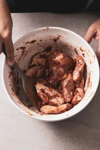 Toss the chicken wings in the marinade.