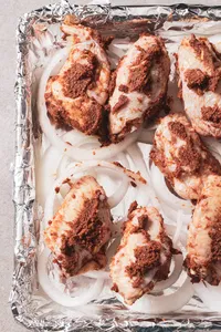 Place the wings on the cooking sheet to broil.