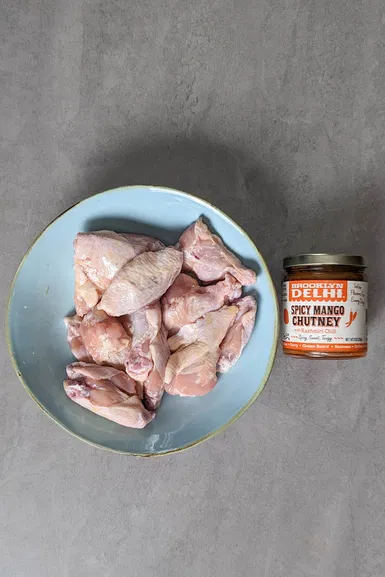 Ingredients for mango chutney wings: Mango chutney and chicken wings.