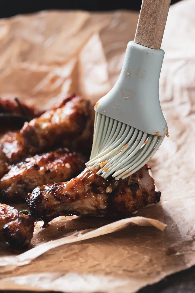 Basting a chicken wing