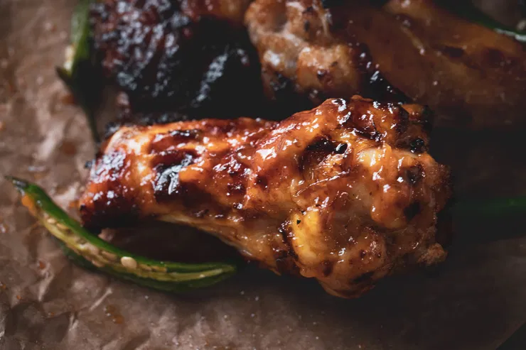 Close up of a mango drumette.