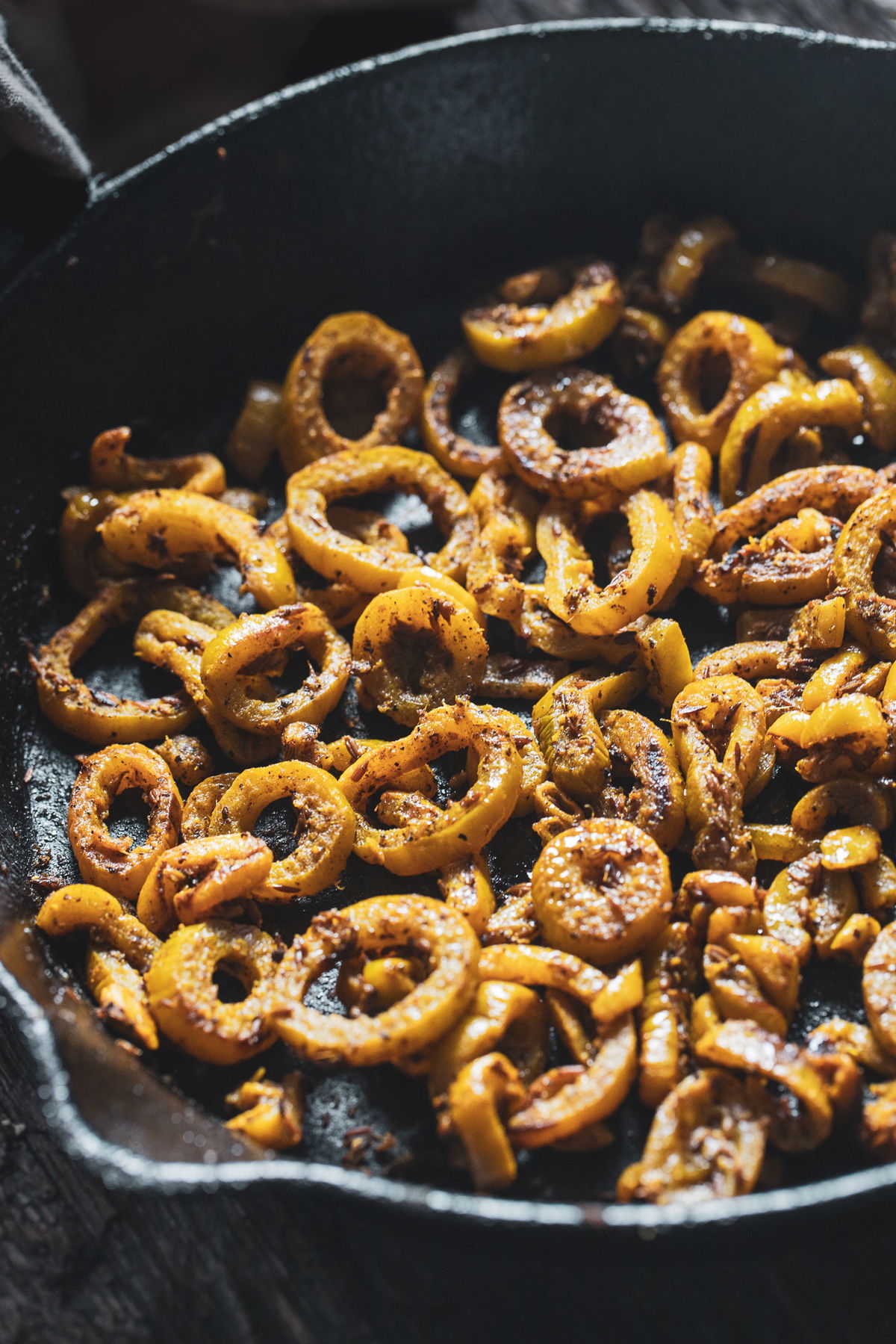 Snake gourd in a cast iron pan.