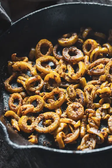 Snake gourd in a cast iron pan.