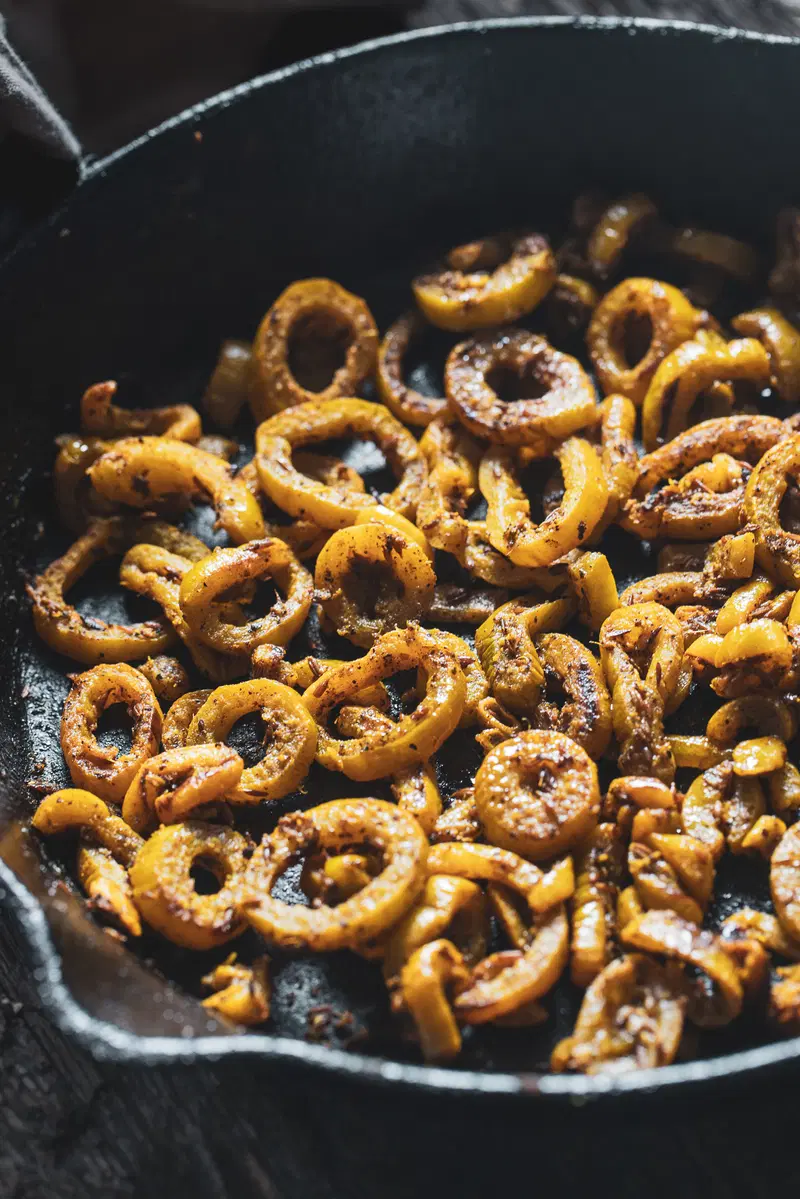 Snake gourd in a cast iron pan.