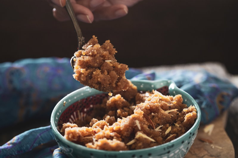Spooning out some badam halwa