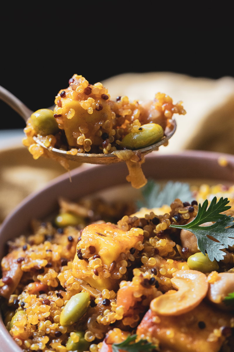 Taking a spoon of quinoa paneer pulao.