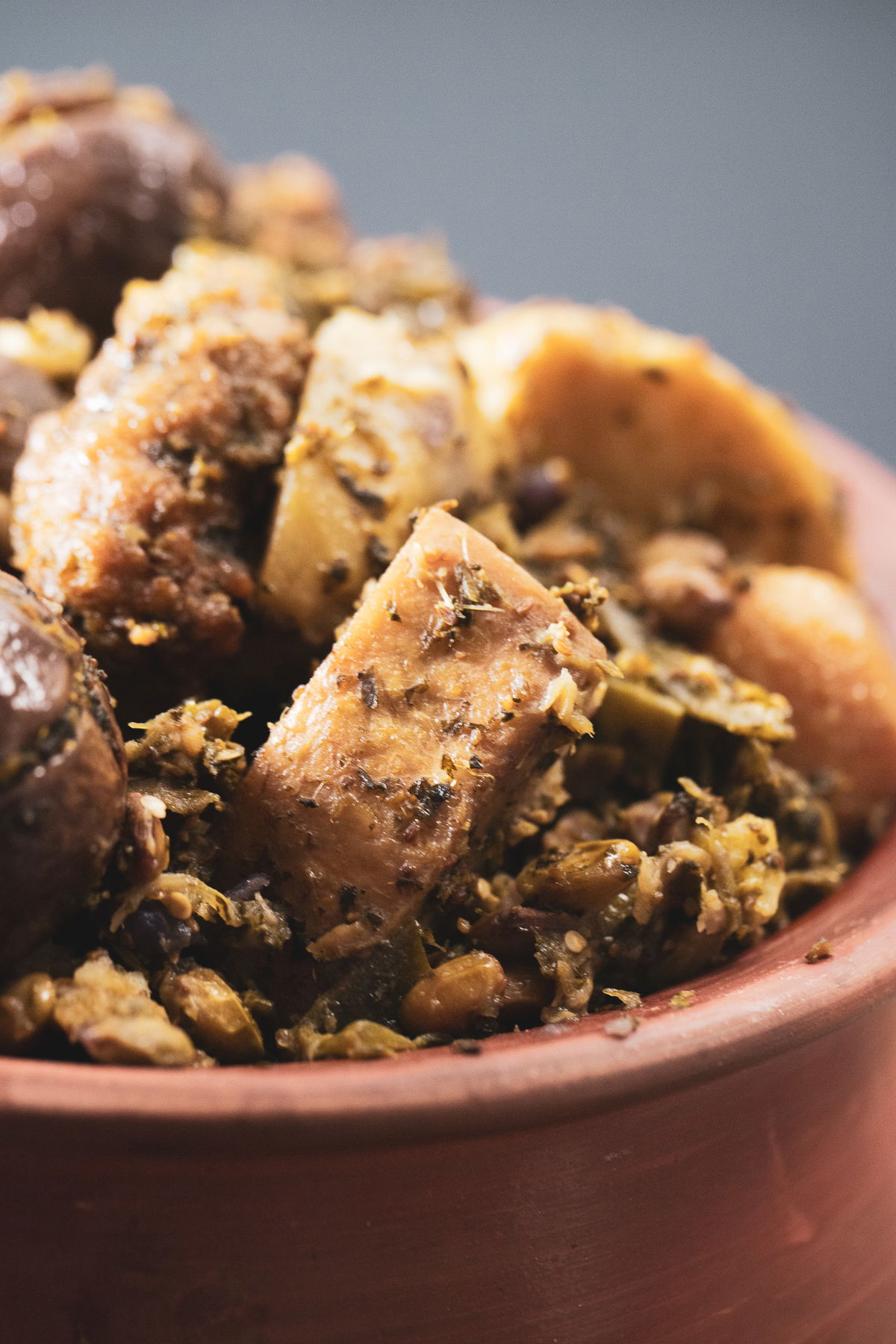 A bowl of surti undhiyu in a clay pot